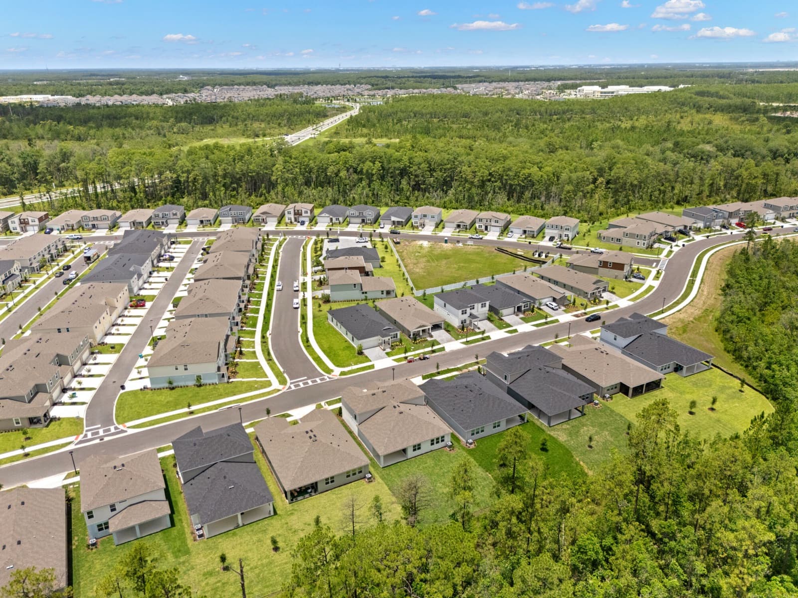 Vista aérea de Meridian Parks: viviendas, lagos y reservas naturales en Lake Nona, Orlando